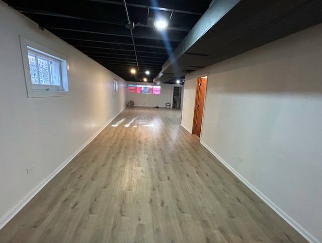 basement featuring hardwood / wood-style floors