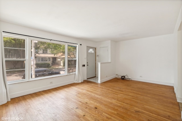 interior space with light wood-type flooring and a healthy amount of sunlight