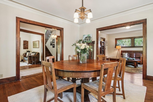 412 Pleasant St, Oak Park, IL 60302 - dining area with stairway, wood finished floors, a chandelier, and ornamental molding