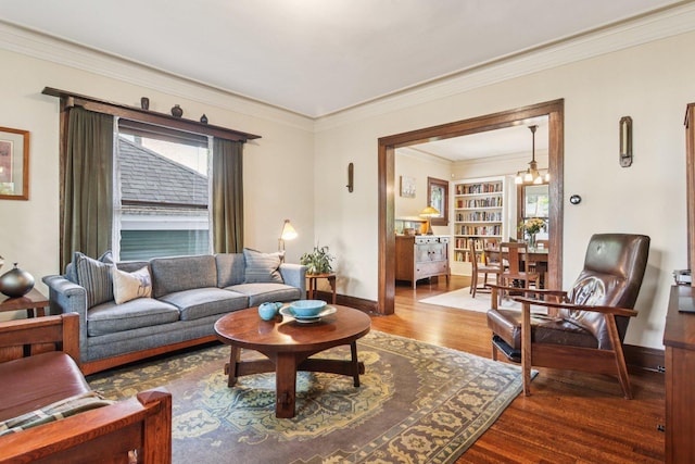 412 Pleasant St, Oak Park, IL 60302 - living area with wood finished floors, a chandelier, and crown molding