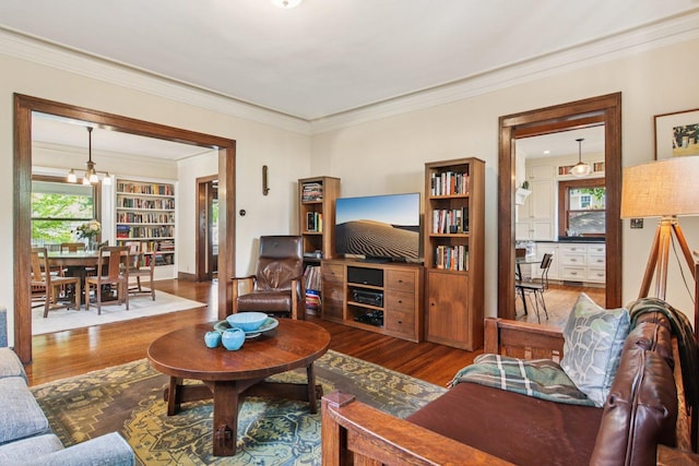 412 Pleasant St, Oak Park, IL 60302 - living area with wood finished floors, healthy amount of natural light, and ornamental molding