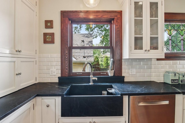 412 Pleasant St, Oak Park, IL 60302 - kitchen featuring white cabinetry, tasteful backsplash, glass insert cabinets, and stainless steel dishwasher