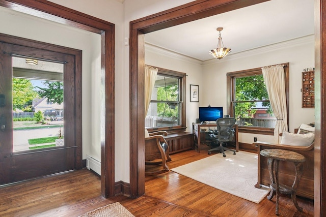 412 Pleasant St, Oak Park, IL 60302 - office space with healthy amount of natural light, ornamental molding, baseboard heating, and wood finished floors
