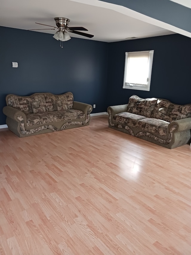 unfurnished living room with ceiling fan and light hardwood / wood-style flooring