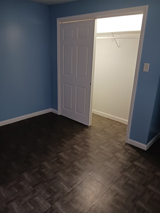 unfurnished bedroom with a closet