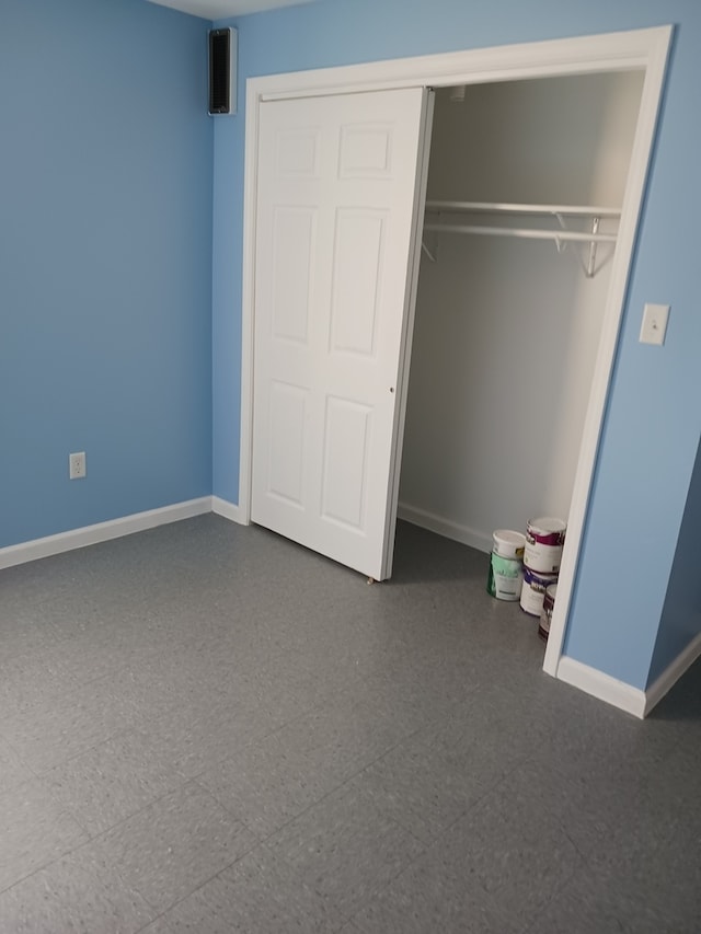 unfurnished bedroom featuring a closet