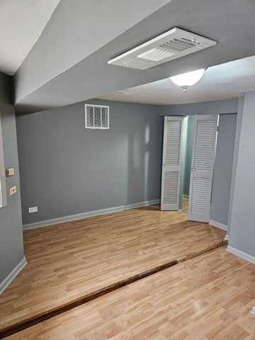 spare room featuring light hardwood / wood-style flooring