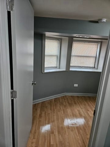 spare room with light hardwood / wood-style floors