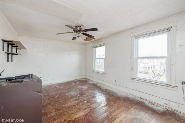 interior space with ceiling fan and dark hardwood / wood-style floors