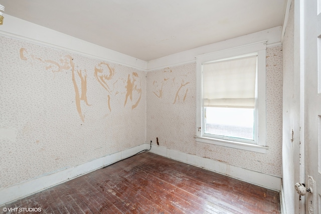 empty room featuring dark hardwood / wood-style floors