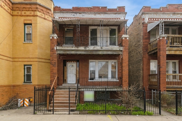 view of front of house with a balcony