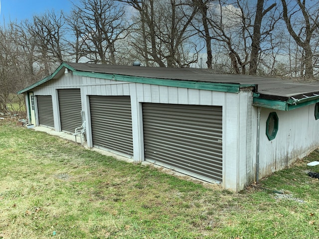 garage with a yard