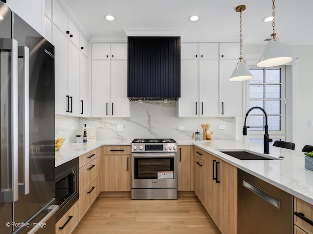 kitchen with custom range hood, light wood-type flooring, light stone counters, stainless steel appliances, and white cabinetry