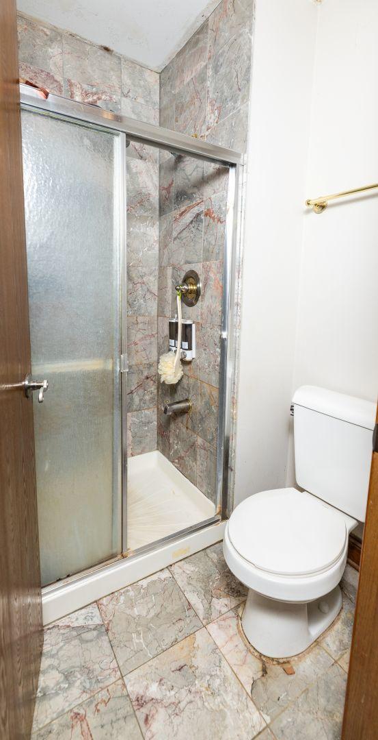 39 Mill Pond Dr, Glendale Heights, IL 60139 - full bathroom with a shower stall and marble finish flooring