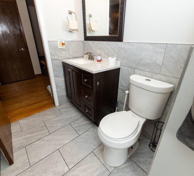 39 Mill Pond Dr, Glendale Heights, IL 60139 - bathroom with tile walls, vanity, wainscoting, and tile patterned flooring