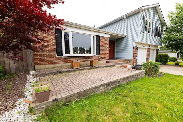 39 Mill Pond Dr, Glendale Heights, IL 60139 - view of front of home with concrete driveway, an attached garage, and brick siding