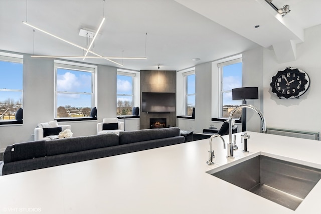 kitchen with sink and a fireplace