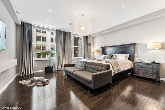 bedroom featuring dark hardwood / wood-style flooring