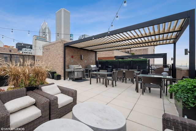 view of patio / terrace featuring a pergola and grilling area