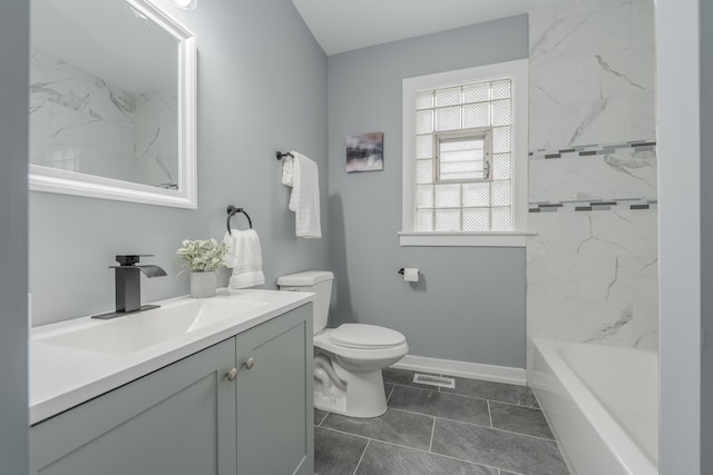 full bathroom featuring tiled shower / bath combo, toilet, vanity, and tile flooring