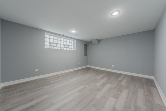 basement featuring light hardwood / wood-style floors