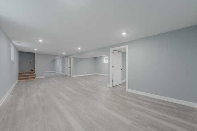 basement featuring light wood-type flooring