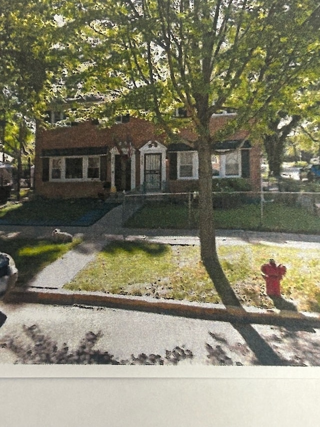 6502 S Wolcott Ave, Chicago, IL 60636 - view of front of property with a front yard