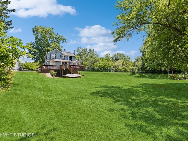 view of yard with a wooden deck