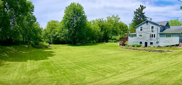 8001 Blivin St, Spring Grove, IL 60081 - view of green lawn featuring stairway and a deck