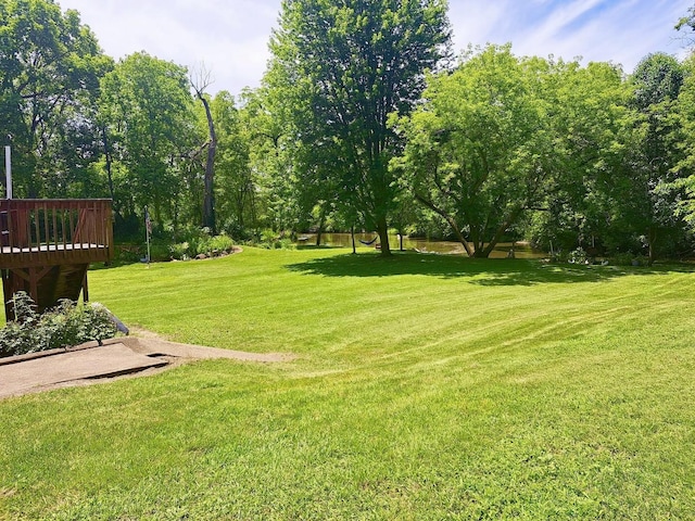 view of yard with a wooden deck