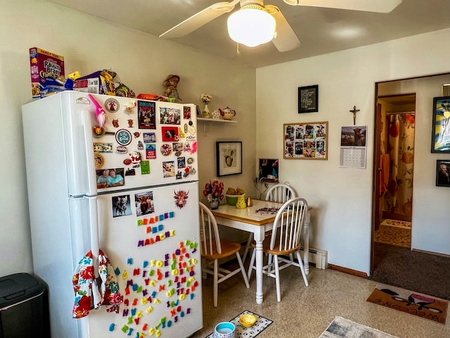 kitchen with light colored carpet, ceiling fan, and white fridge