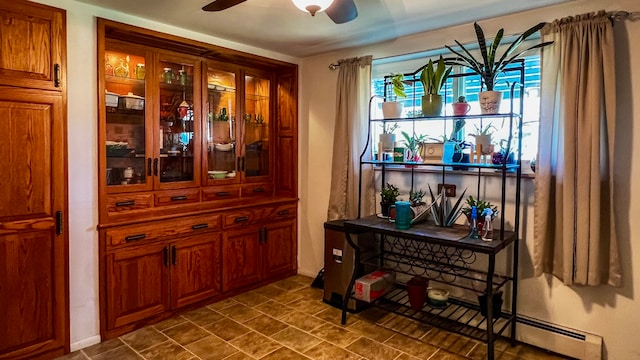 bar featuring ceiling fan, baseboard heating, and tile flooring