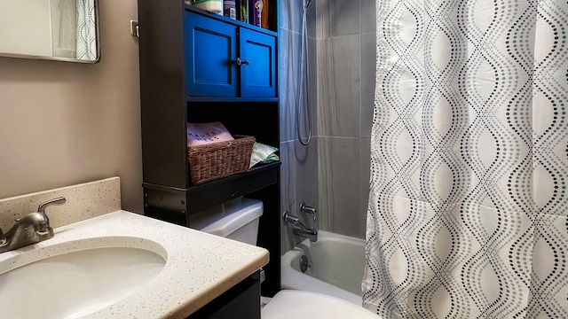 full bathroom featuring shower / bath combo, toilet, and vanity