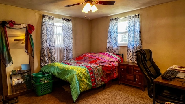 carpeted bedroom featuring ceiling fan