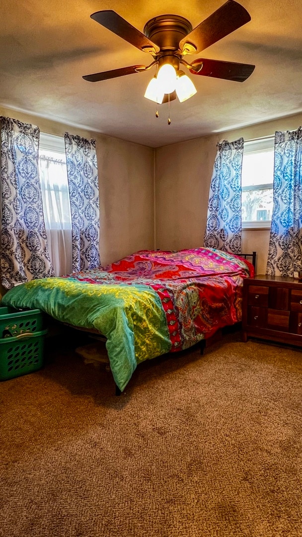 bedroom with carpet and ceiling fan