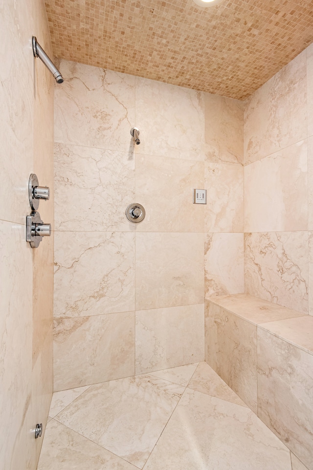 bathroom with a tile shower