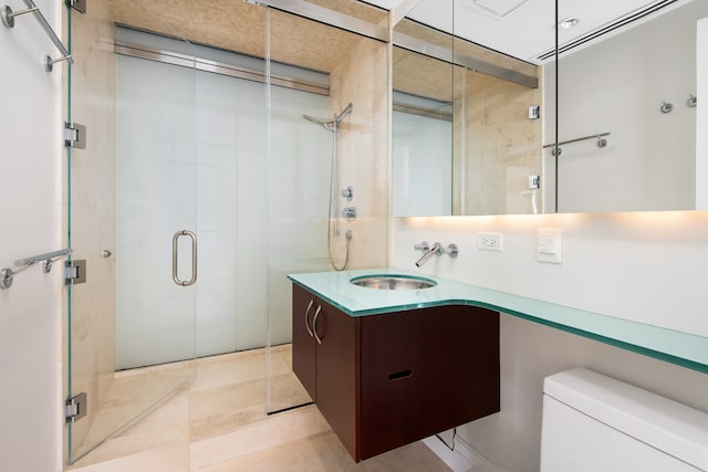 bathroom featuring toilet, tile flooring, an enclosed shower, and vanity