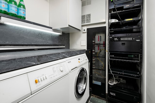 clothes washing area featuring separate washer and dryer