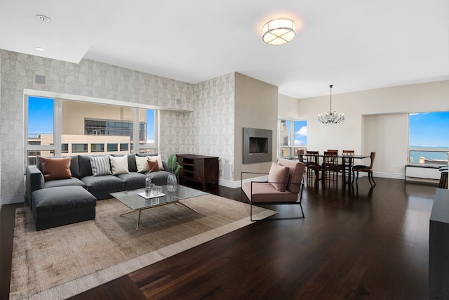 living room featuring dark hardwood / wood-style flooring and a notable chandelier