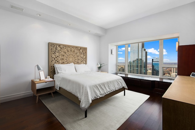 bedroom featuring dark hardwood / wood-style flooring