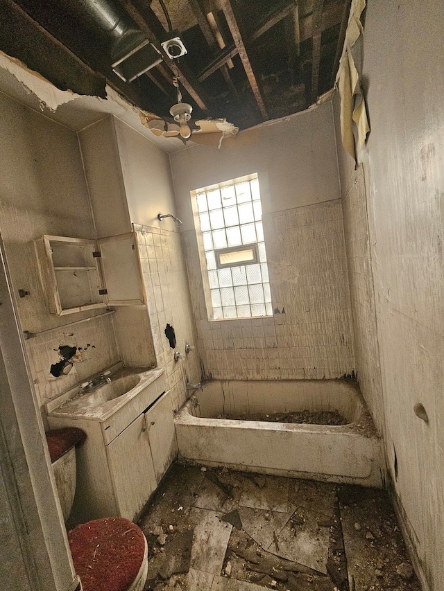 bathroom featuring tile floors, bathtub / shower combination, and toilet