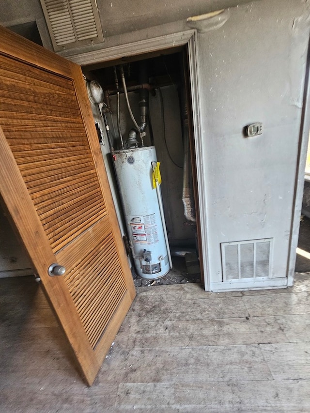 utility room with water heater