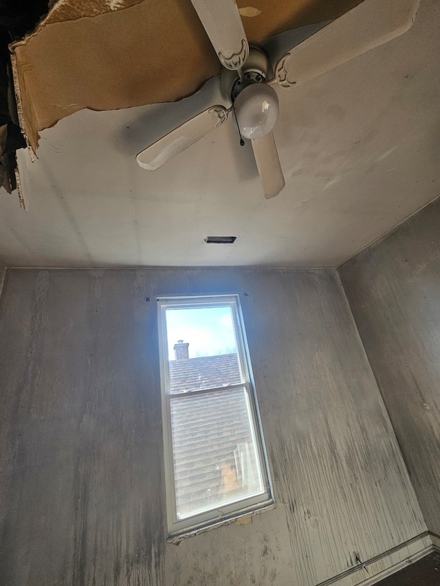 interior space with ceiling fan and wood-type flooring