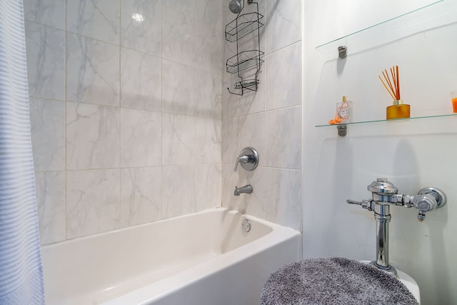 bathroom featuring shower / bath combo with shower curtain