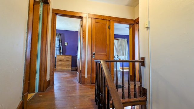 corridor with dark wood-type flooring