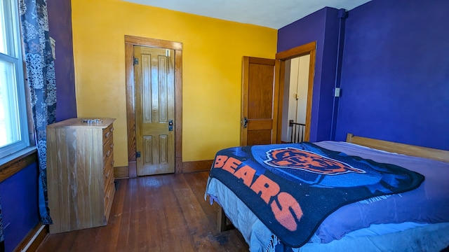 bedroom featuring dark wood-type flooring