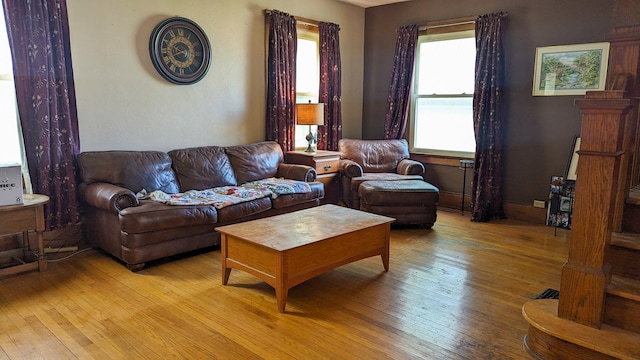 living room with a wealth of natural light and hardwood / wood-style floors