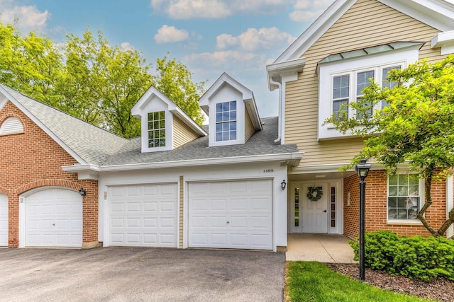 1405 Apricot Ct Unit D, Mount Prospect, IL 60056 - view of front facade with a garage, asphalt driveway, brick siding, and a shingled roof