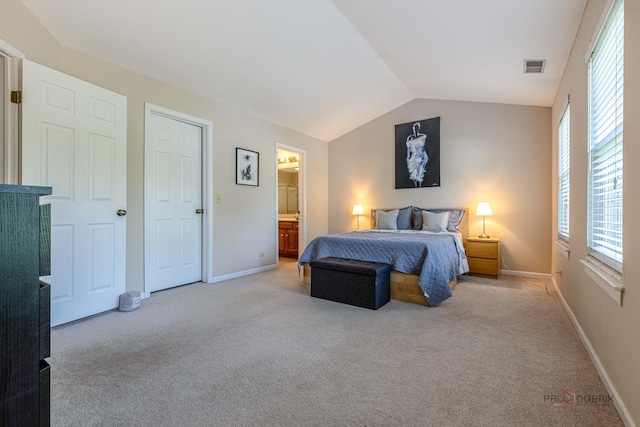 1405 Apricot Ct Unit D, Mount Prospect, IL 60056 - bedroom featuring light carpet, lofted ceiling, baseboards, and ensuite bathroom
