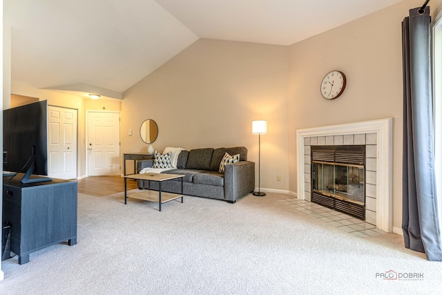 1405 Apricot Ct Unit D, Mount Prospect, IL 60056 - living room with carpet floors, vaulted ceiling, a tile fireplace, and baseboards